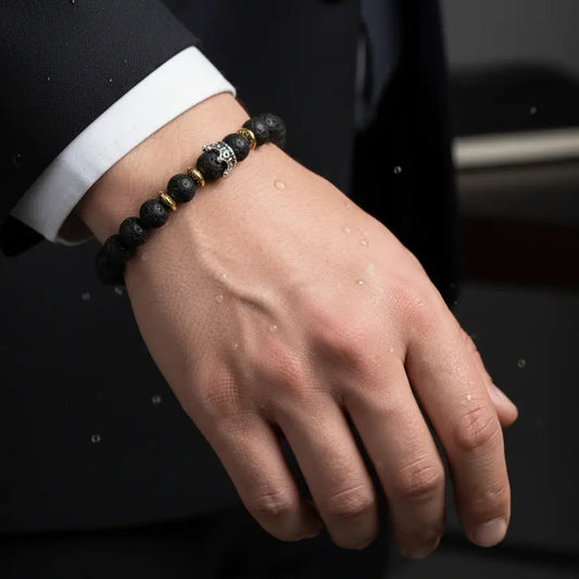 The 'Beets' collection grounding bracelet with round black lava beads and personalized engraved sphere.