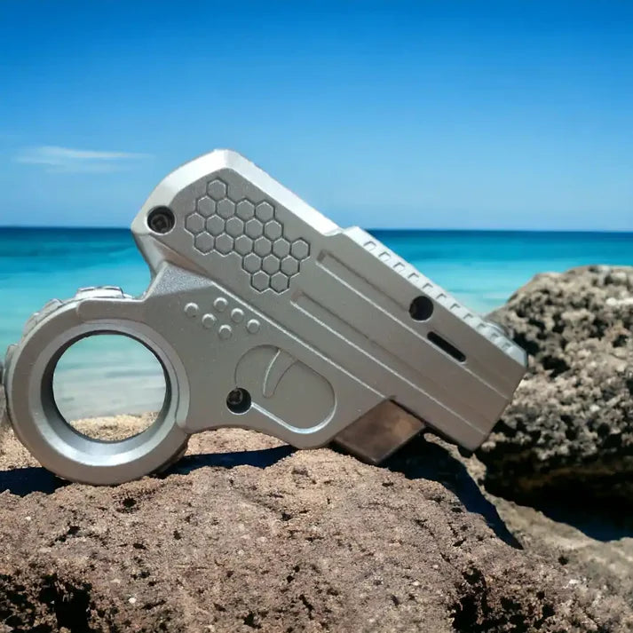 mini-gun-shape-lighter on Rock