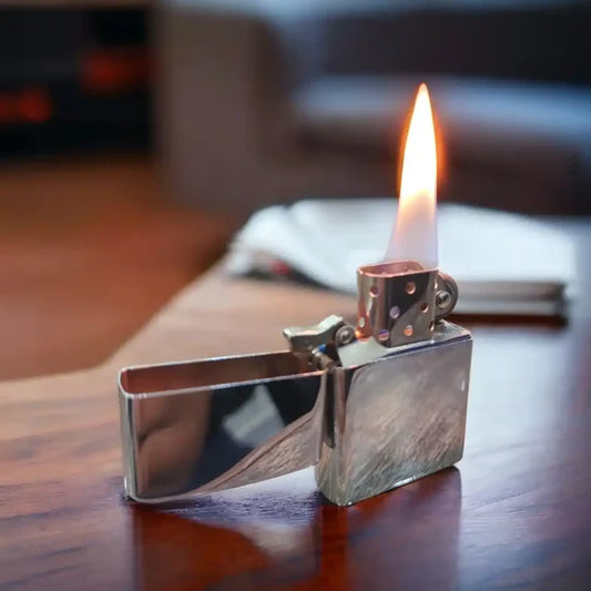 Silver Spark Zippo Lighter with flame on the Table