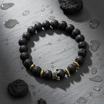 "The 'Beets' collection grounding bracelet with round black lava beads and personalized engraved silver sphere."