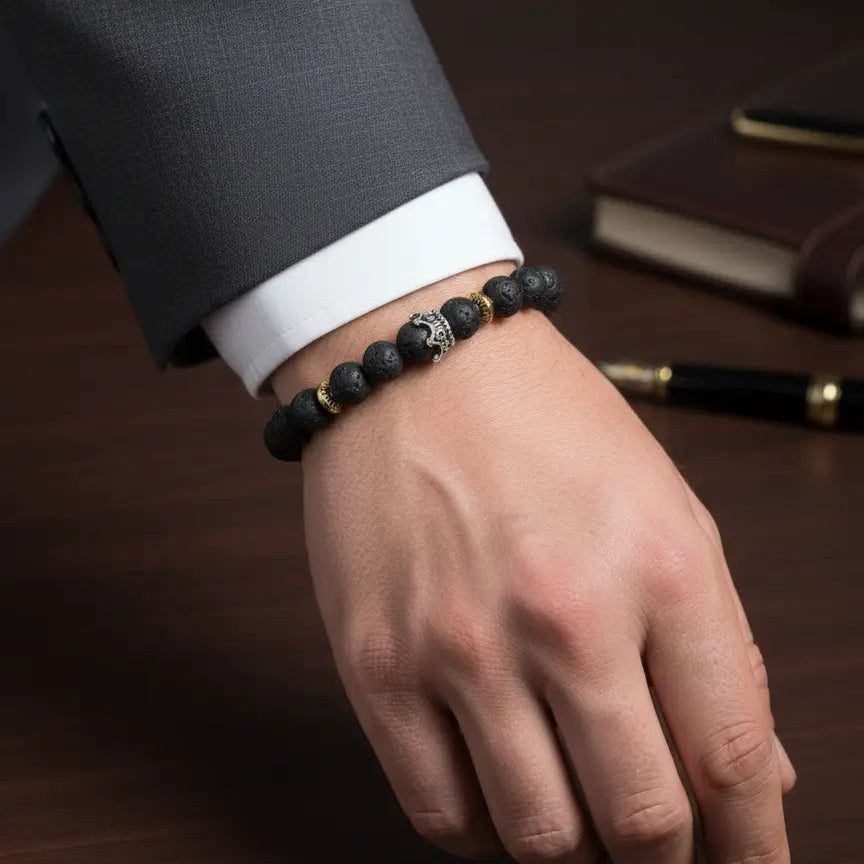 Men's classic stretch bracelet made with porous black lava beads and a sterling silver accent bead.
