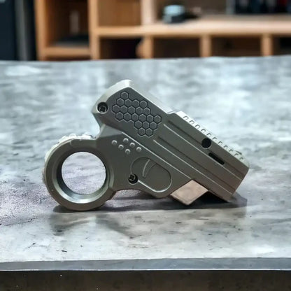 mini-gun-shape-lighter on a table