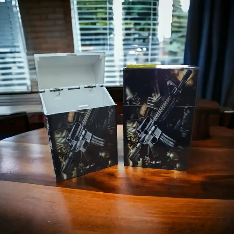 Pop Open Cigarette Case with the weapon on a table