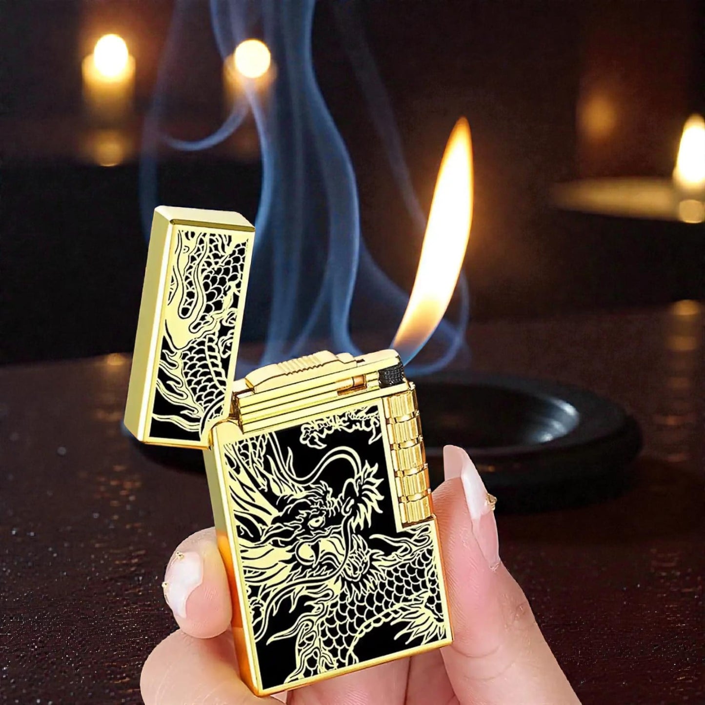 Gold lighter with dragon design being held, showing an open flame.