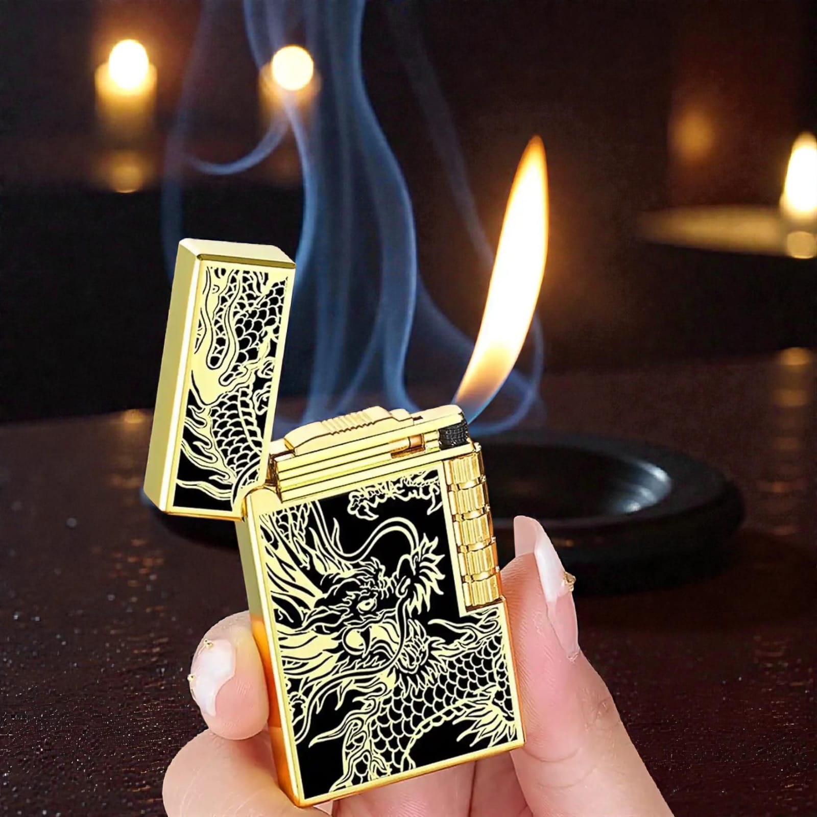 Gold lighter with dragon design being held, showing an open flame.